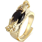 deux tetes de dragon noir sur une bague en or