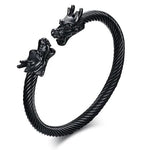 une bracelet noir avec deux tetes de dragon